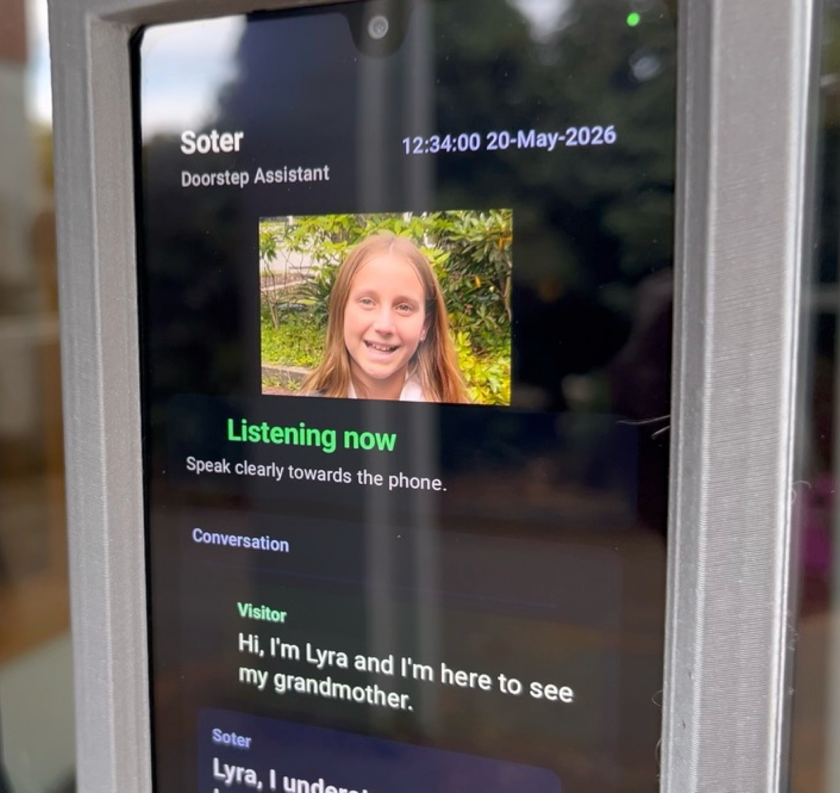 Family member checking doorstep alerts with Soter